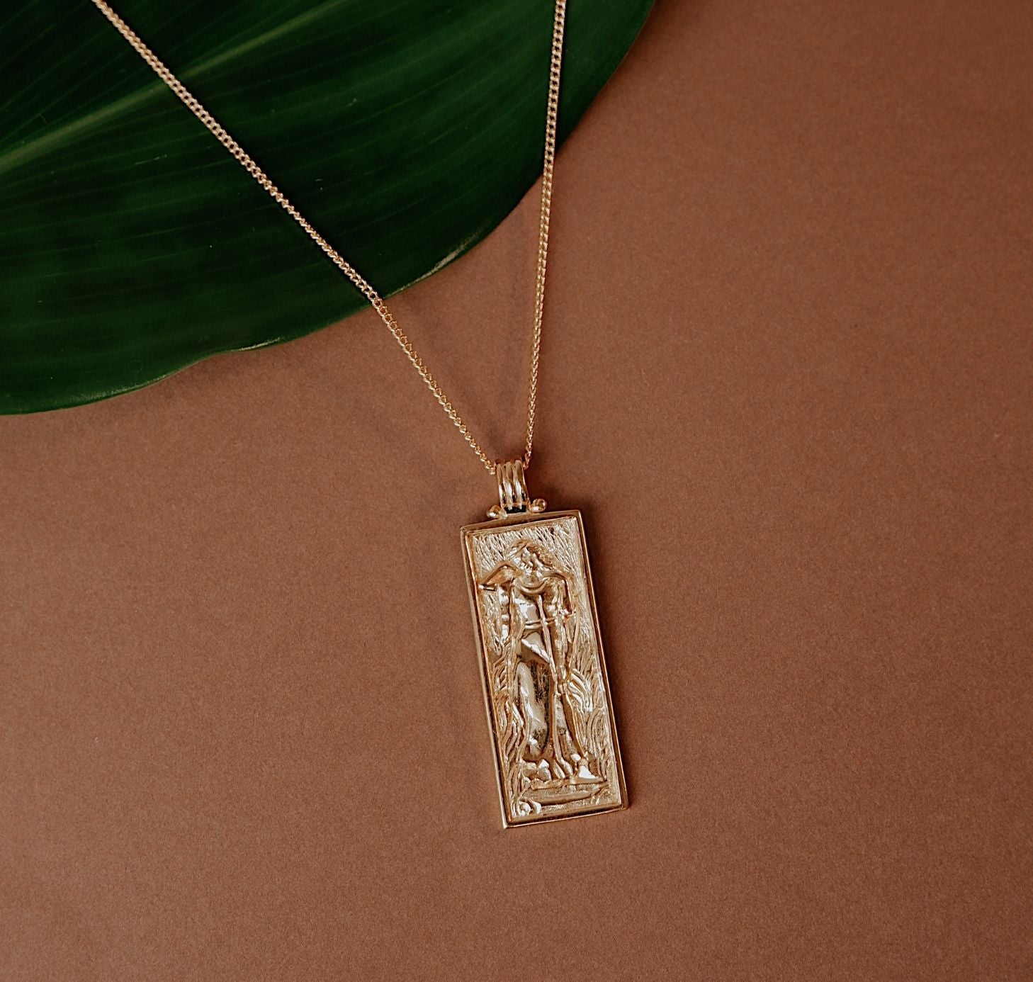 Freyja Goddess of Love Pendant  flat lay in brown background