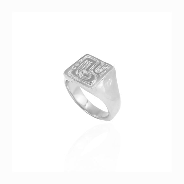 Detailed view of a silver ring against a white background