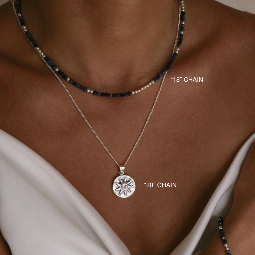 Two necklaces with labeled chain lengths on a person wearing a white top.