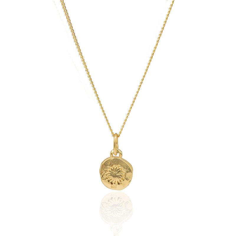 Mini St. Christopher necklace photographed on a clean white surface.