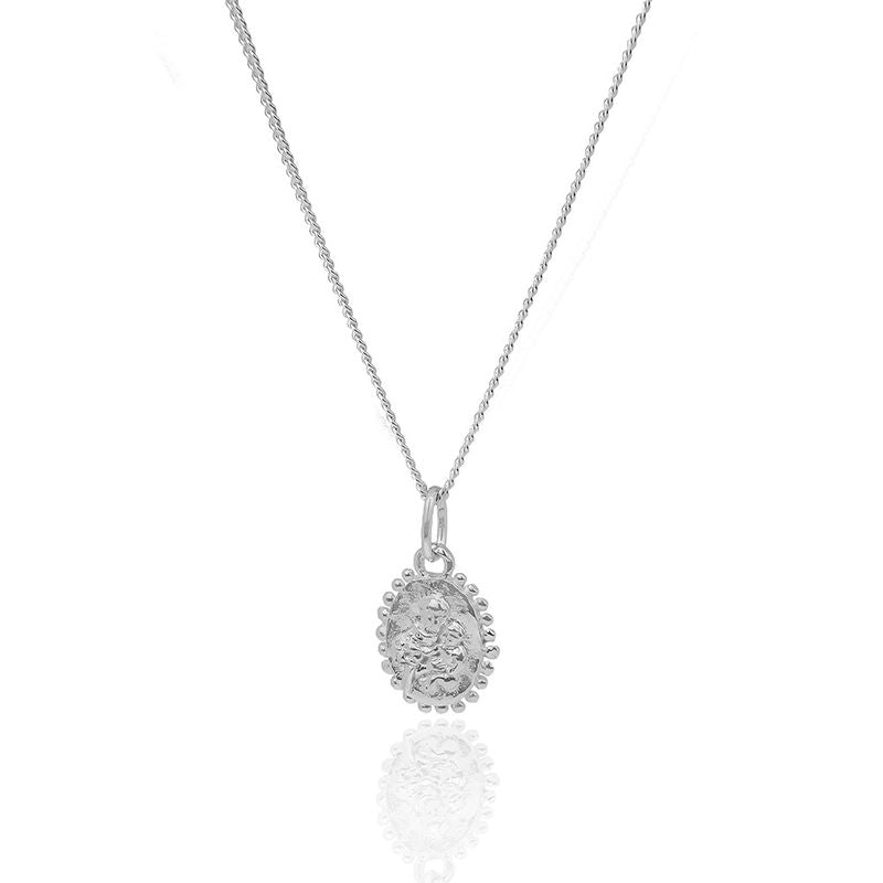 Minimalist mini St. Anthony  necklace showcased on a white surface