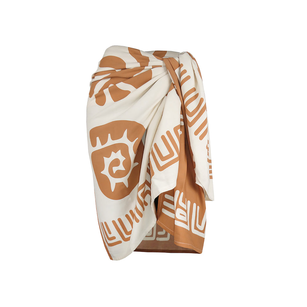 Paradise sarong in print Tuscan Clay , wrapped and draped against a solid white background.