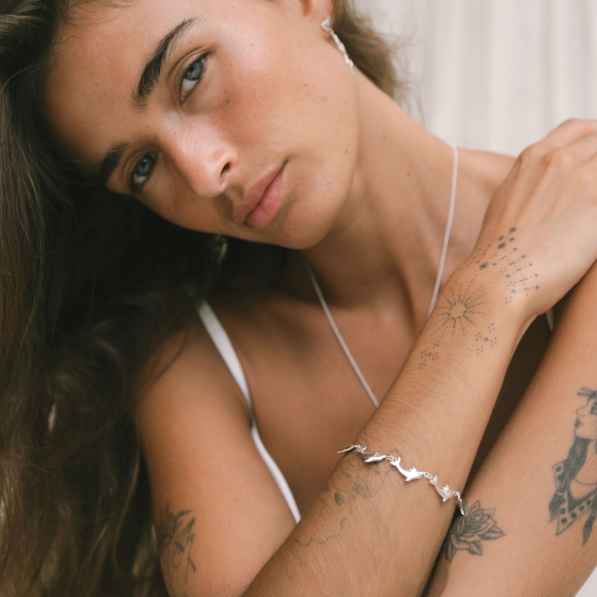 Handmade Luna & Rose x Tahnee Kelland ‘Vibes Don’t Lie’ silver bracelet, dolphin design symbolising flow, crafted sustainably in Bali style.