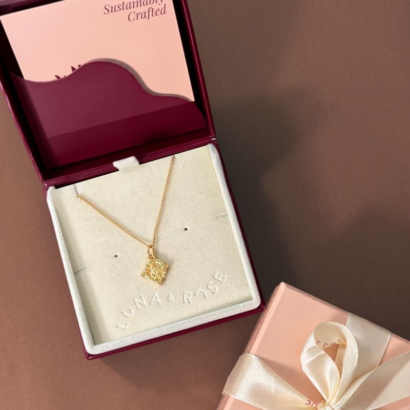 St. Dymphna medallion necklace presented in a simple white setting
