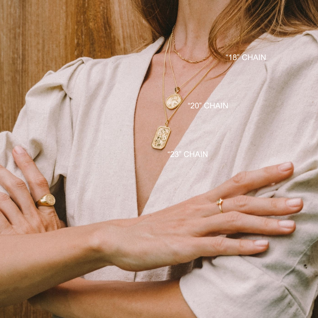 a woman wearing gold jewelry from luna rose