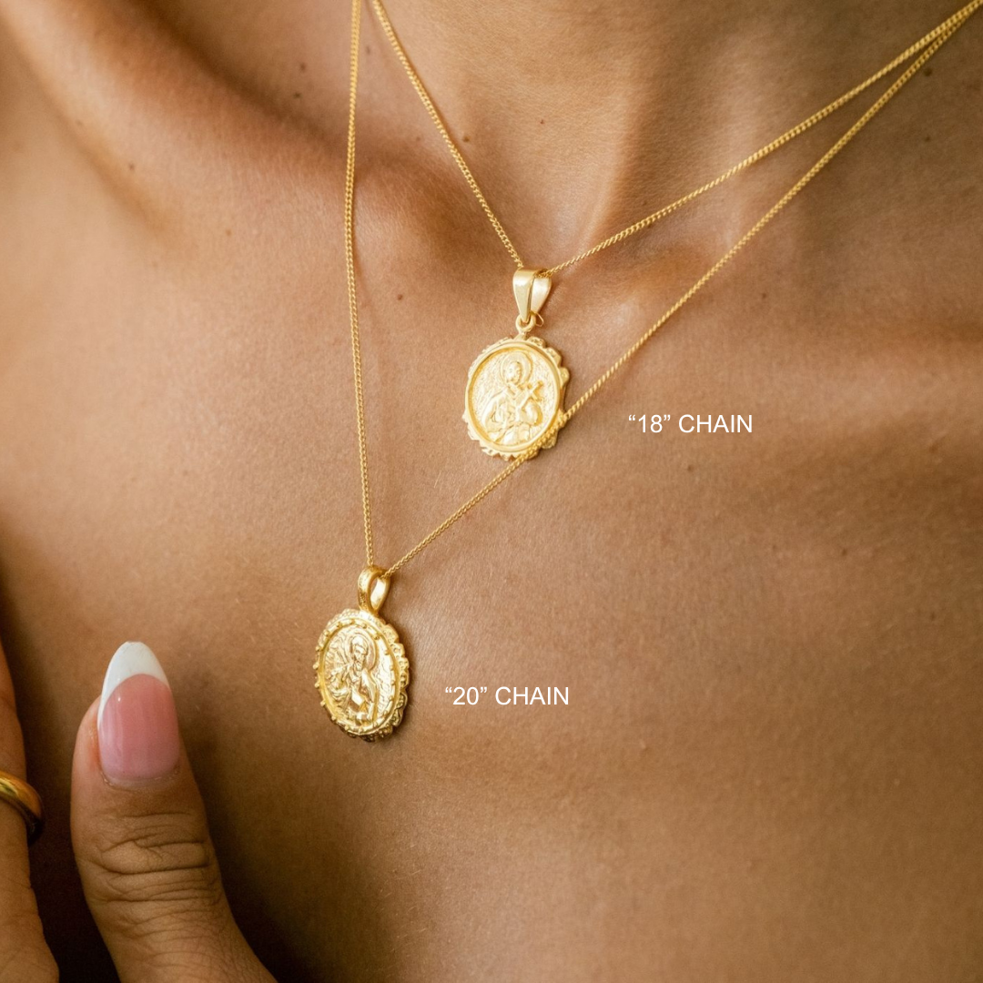 Two gold necklaces with pendants on a person's neck, labeled '18' chain' and '20' chain'.