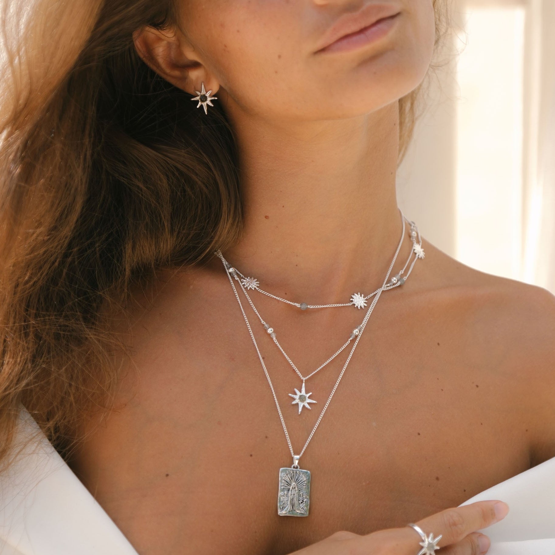 Handcrafted Luna & Rose x Tahnee Kelland ‘Warm Love’ silver necklace, featuring sun charms and labradorite gemstones, ethical jewellery made in Bali. Model layering necklaces