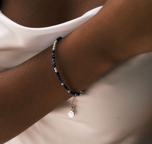 a woman wearing The Indigo Tide Bracelet Silver by Luna and Rose Bali 