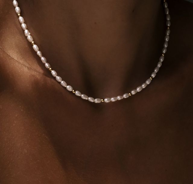 a woman wearing The Remi Necklace Gold by Luna and Rose Bali 