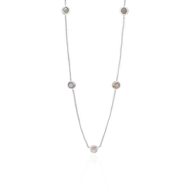 The Noa Necklace - Silver face design in white reflection 