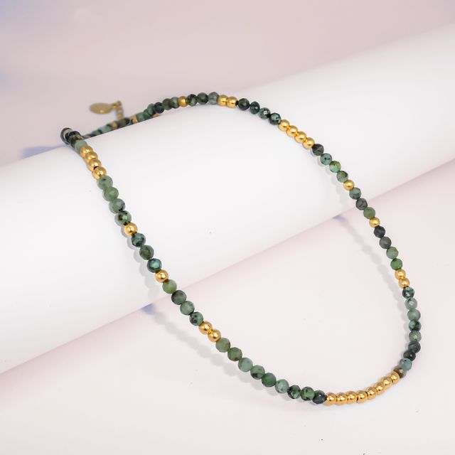 The Valley Necklace - Gold placed on a white roll