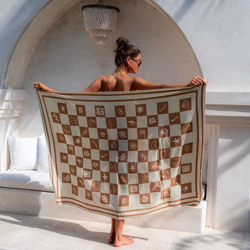 Woman in a Tuscan clay sarong enjoying a sunny day