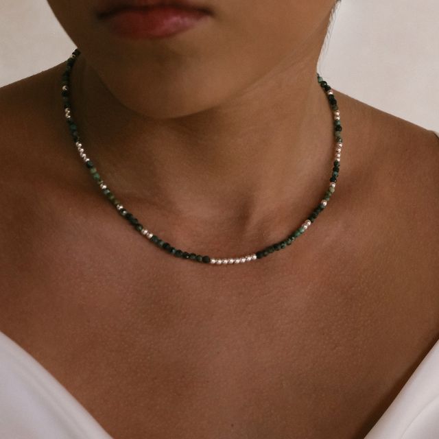 a single necklace on her 