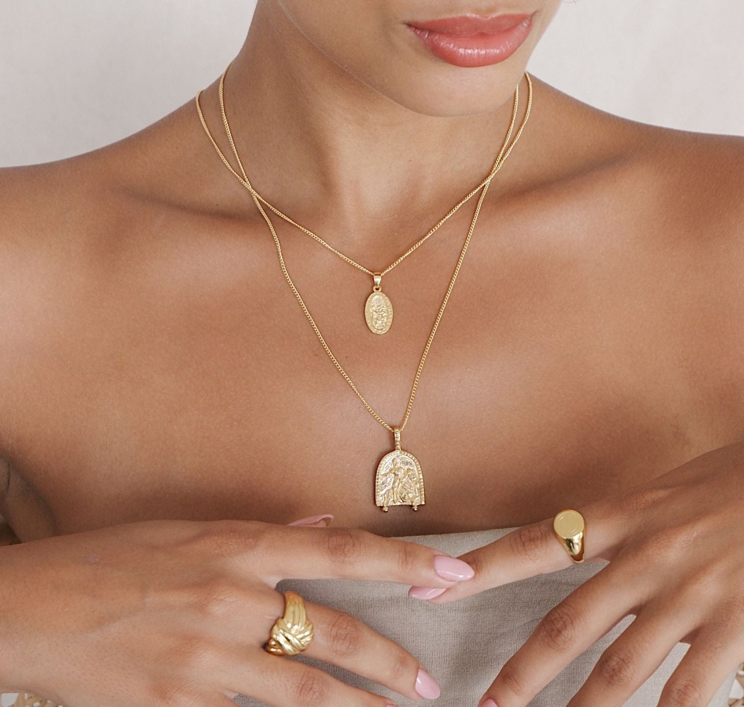 a woman with her jewelry gold