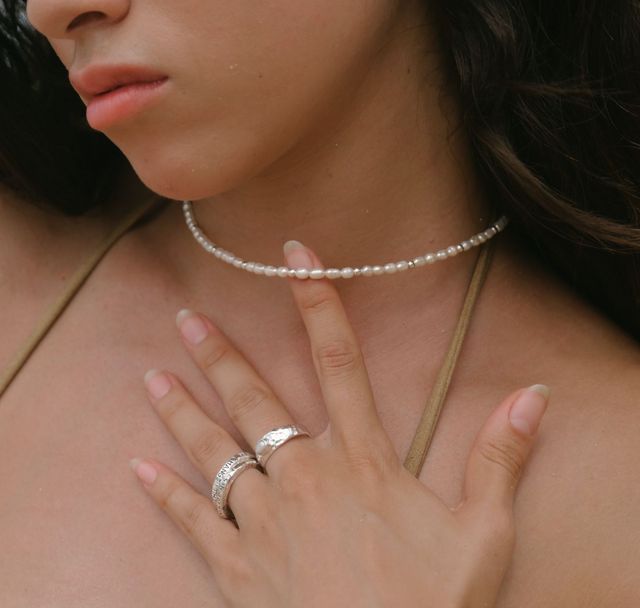 a woman with her pearl necklace