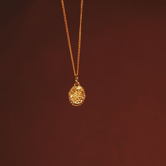 front side of mini St Anthony  charm gold