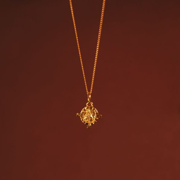 front side of mini St Dymphna charm gold