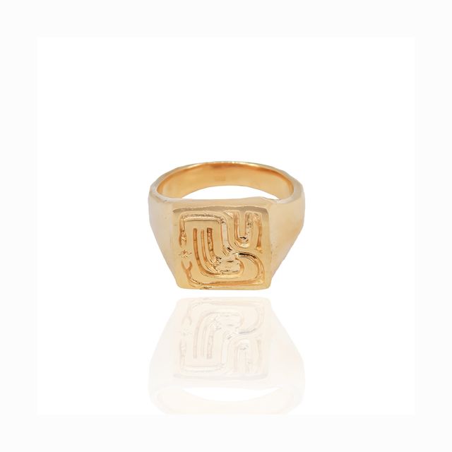 Chic gold ring  piece displayed on a white surface