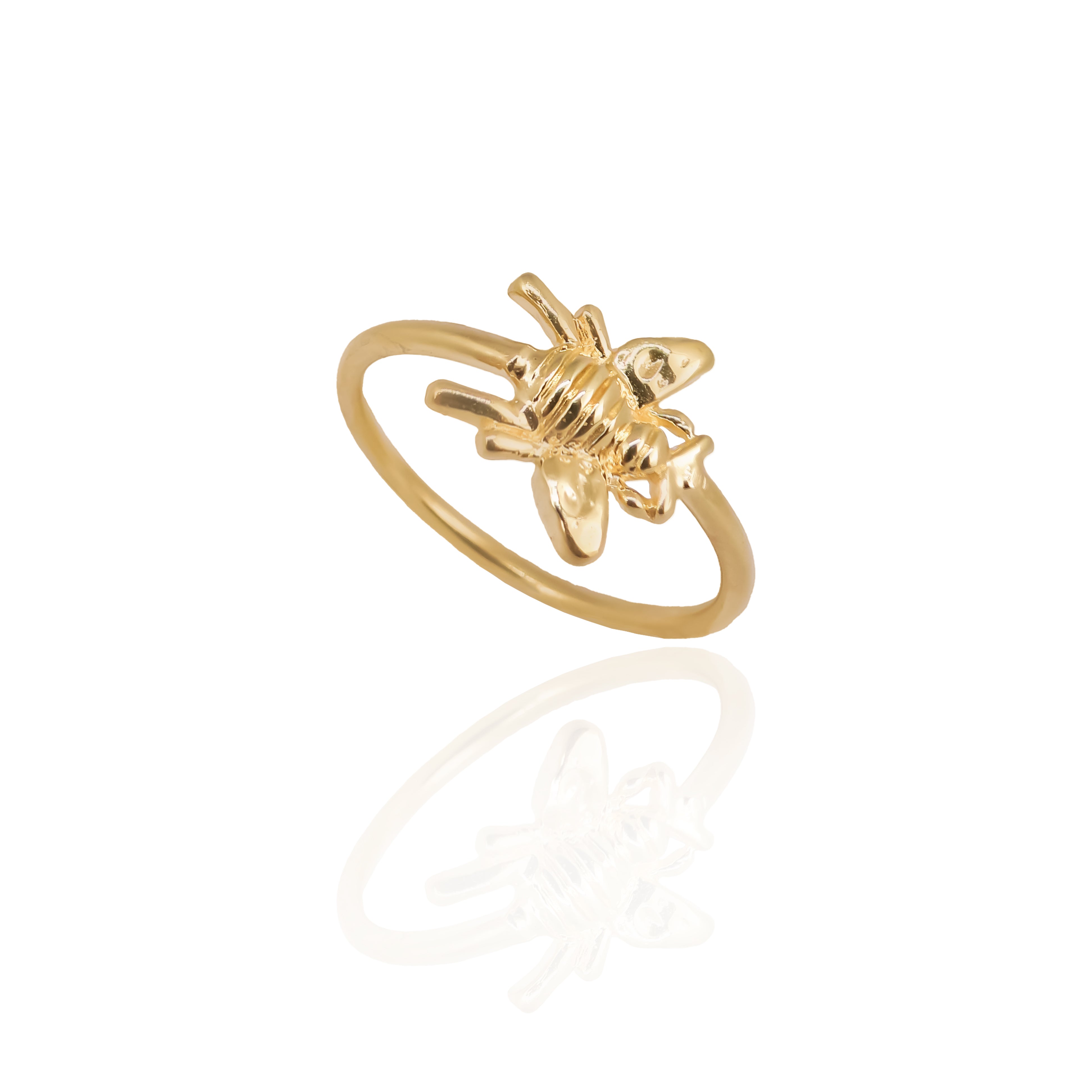 Gold ring with a unique design on a white background