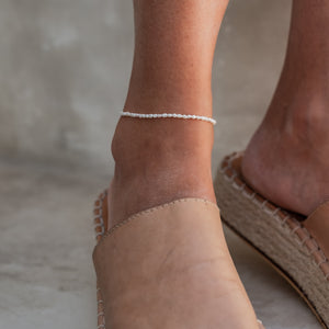 Timeless Mini Pearl Anklet - Silver on a woman