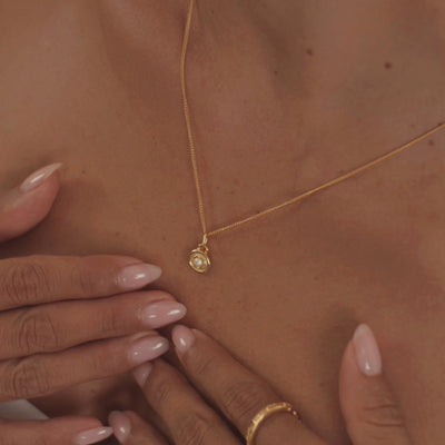 A model wearing a stunning pearl necklace, highlighting the gem's delicate sheen and timeless style.
