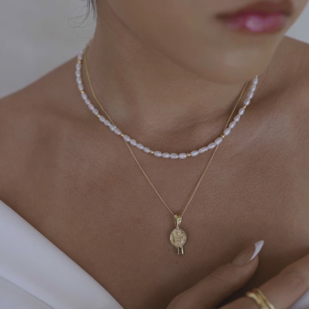 The Remi Necklace gold layered with St valentine necklace gold 