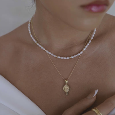 The Remi Necklace gold layered with St valentine necklace gold 