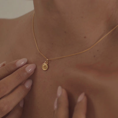 A model wearing a stunning citrine necklace, highlighting the gemstone's warm golden glow and radiant clarity.