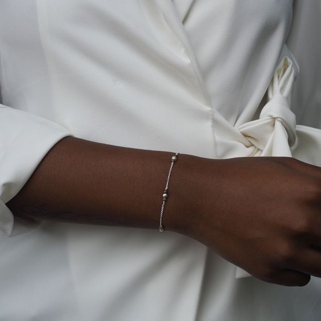 quinn bracelet silver on a woman with white blazer