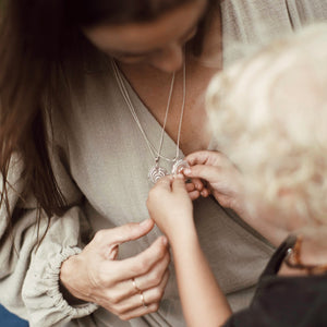 SOJOURNER TRUTH Motherhood Strength Hopi Symbol Necklace in 18kt Gold with Child